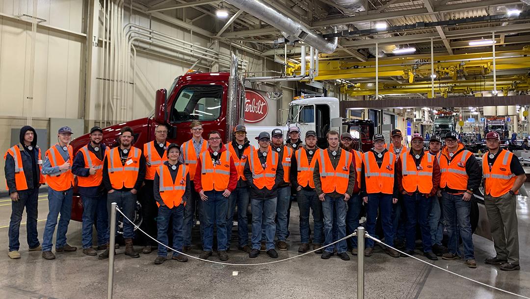 19 Truck Technician program students visiting the Peterbilt truck building facility in Denton, TX. 